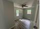 This bedroom offers natural light, hardwood floors, and a ceiling fan at 4610 Wilson James Sw Rd, Atlanta, GA 30331