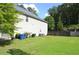 Expansive backyard featuring a lush green lawn and privacy fence, perfect for outdoor enjoyment at 5896 Cliftondale Dr, Atlanta, GA 30349