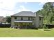 Large backyard features a covered patio and plenty of open grassy area at 5896 Cliftondale Dr, Atlanta, GA 30349