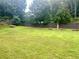 Grassy backyard enclosed by a wooden fence at 5896 Cliftondale Dr, Atlanta, GA 30349