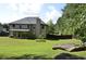 Spacious backyard with a large grassy area, perfect for outdoor activities and relaxation at 5896 Cliftondale Dr, Atlanta, GA 30349