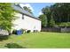 Expansive backyard featuring a lush green lawn and privacy fence, perfect for outdoor enjoyment at 5896 Cliftondale Dr, Atlanta, GA 30349