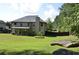 Spacious backyard with a large grassy area, perfect for outdoor activities and relaxation at 5896 Cliftondale Dr, Atlanta, GA 30349