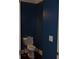 A cozy powder room features dark blue walls at 5896 Cliftondale Dr, Atlanta, GA 30349