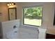 Primary bathroom features a soaking tub with a large window at 5896 Cliftondale Dr, Atlanta, GA 30349