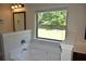 Primary bathroom features a soaking tub with a large window at 5896 Cliftondale Dr, Atlanta, GA 30349