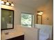 Bright bathroom features a soaking tub and a separate shower at 5896 Cliftondale Dr, Atlanta, GA 30349