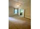 Spacious bedroom featuring high ceilings, a ceiling fan, and a large window at 5896 Cliftondale Dr, Atlanta, GA 30349