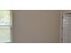 Minimalist bedroom with window, door, and neutral color scheme at 5896 Cliftondale Dr, Atlanta, GA 30349