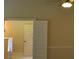 Bedroom features a ceiling fan and double doors to another room at 5896 Cliftondale Dr, Atlanta, GA 30349