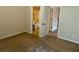 Bedroom with neutral walls, carpet, and attached bathroom featuring a shower at 5896 Cliftondale Dr, Atlanta, GA 30349