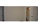 Bright bedroom with a view into the bathroom and closet, and a clean and minimalist design at 5896 Cliftondale Dr, Atlanta, GA 30349