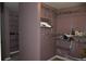 Spacious walk-in closet includes wire shelving and hanging rods at 5896 Cliftondale Dr, Atlanta, GA 30349