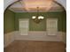 Elegant dining room showcasing coffered ceilings, wainscoting, and a stylish chandelier at 5896 Cliftondale Dr, Atlanta, GA 30349