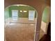 Dining area featuring wainscoting, neutral carpet, and a stylish chandelier at 5896 Cliftondale Dr, Atlanta, GA 30349