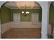 Well-lit dining room with coffered ceilings, carpet flooring, and wainscotting at 5896 Cliftondale Dr, Atlanta, GA 30349