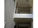 Foyer with tall ceilings and decorative iron railing overlooking the living room archway at 5896 Cliftondale Dr, Atlanta, GA 30349