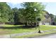 Charming two-story home with manicured lawn and mature trees at 5896 Cliftondale Dr, Atlanta, GA 30349