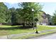 Charming two-story home with manicured lawn and mature trees at 5896 Cliftondale Dr, Atlanta, GA 30349