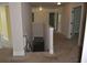 Hallway with staircase down, neutral walls, plush carpeting, and white doors at 5896 Cliftondale Dr, Atlanta, GA 30349