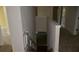 Hallway with staircase down, neutral walls, plush carpeting, and white doors at 5896 Cliftondale Dr, Atlanta, GA 30349
