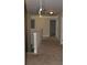 Hallway with neutral paint, carpet, and traditional trim at 5896 Cliftondale Dr, Atlanta, GA 30349