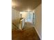 Second story hallway with carpet, white trim, and doors leading to various rooms at 5896 Cliftondale Dr, Atlanta, GA 30349