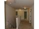 Upstairs hallway featuring neutral walls, plush carpeting, and white doors at 5896 Cliftondale Dr, Atlanta, GA 30349