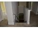Hallway with staircase down, neutral walls, plush carpeting, and white doors at 5896 Cliftondale Dr, Atlanta, GA 30349