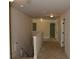 Upstairs hallway featuring neutral walls, plush carpeting, and white doors at 5896 Cliftondale Dr, Atlanta, GA 30349