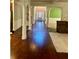 Open hallway features hardwood flooring, decorative arches, and natural light at 5896 Cliftondale Dr, Atlanta, GA 30349