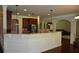 Bright kitchen featuring a granite countertop bar and dark wood cabinets at 5896 Cliftondale Dr, Atlanta, GA 30349
