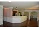 Bright kitchen featuring a granite countertop bar and dark wood cabinets at 5896 Cliftondale Dr, Atlanta, GA 30349