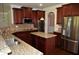 Modern kitchen boasting dark cabinets, granite counters, and stainless steel appliances at 5896 Cliftondale Dr, Atlanta, GA 30349