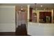 Bright kitchen featuring a granite countertop bar and dark wood cabinets at 5896 Cliftondale Dr, Atlanta, GA 30349