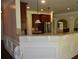 Bright kitchen featuring a granite countertop bar and dark wood cabinets at 5896 Cliftondale Dr, Atlanta, GA 30349