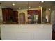 Bright kitchen featuring a granite countertop bar and dark wood cabinets at 5896 Cliftondale Dr, Atlanta, GA 30349