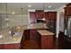 Modern kitchen boasting dark cabinets, granite counters, and stainless steel appliances at 5896 Cliftondale Dr, Atlanta, GA 30349