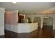 Bright kitchen featuring a granite countertop bar and dark wood cabinets at 5896 Cliftondale Dr, Atlanta, GA 30349