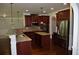 Gourmet kitchen featuring stainless steel appliances, granite countertops, and dark wood cabinetry at 5896 Cliftondale Dr, Atlanta, GA 30349