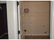 Practical laundry room with hookups and shelving, painted with neutral walls at 5896 Cliftondale Dr, Atlanta, GA 30349