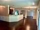 Bright living room featuring hardwood floors, high ceilings, white trim and archways leading to other spaces at 5896 Cliftondale Dr, Atlanta, GA 30349