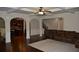 Bright, open-concept living room with hardwood floors, coffered ceiling, and easy kitchen access at 5896 Cliftondale Dr, Atlanta, GA 30349