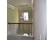 Staircase landing with crown molding and decorative chandelier at 5896 Cliftondale Dr, Atlanta, GA 30349