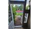 Charming view of a patio set from the sunroom, inviting outdoor relaxation and entertainment at 1297 Tree Creek Ct, Clarkston, GA 30021