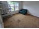 Bedroom with natural light, armchair, and view to the outside at 1297 Tree Creek Ct, Clarkston, GA 30021