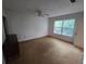 Bedroom featuring neutral walls, ample natural light, and carpeted floor at 1297 Tree Creek Ct, Clarkston, GA 30021