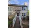 Inviting two-story home with a wooden walkway leading to the front door and a well-maintained yard at 1297 Tree Creek Ct, Clarkston, GA 30021