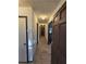 Entryway featuring wood-look floors, neutral walls with contrast trim and updated lighting at 1297 Tree Creek Ct, Clarkston, GA 30021