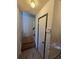 Stairwell with wood-look flooring, contrasting trim and -safe gate at 1297 Tree Creek Ct, Clarkston, GA 30021